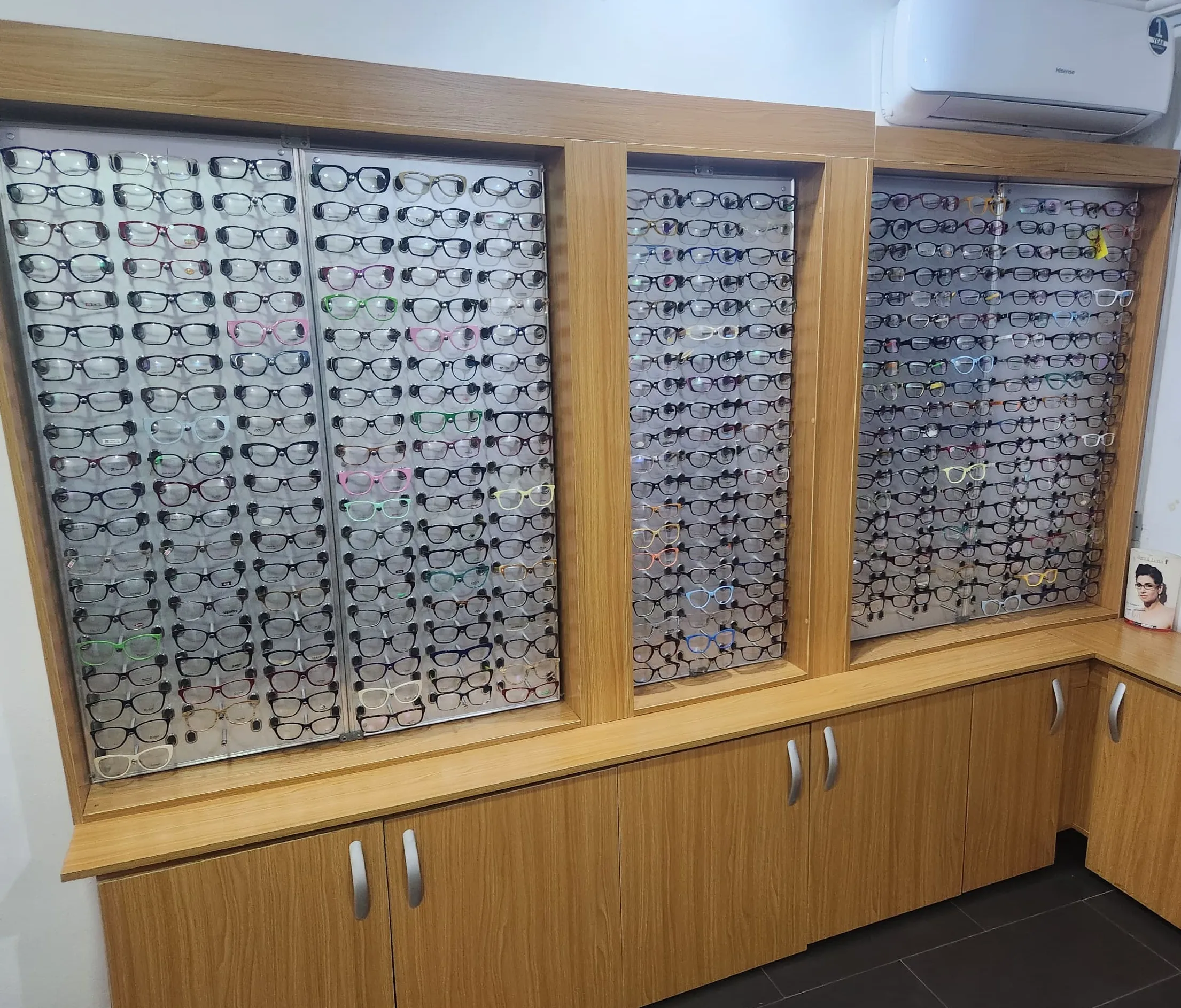 A wide view of the fully stocked eyewear frame wall at Locus Eye Clinic